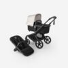 Bugaboo juodas kūdikių vežimėlis su baltu lopšiu ir juoda automobiline kėdute, sportinė dalis priekije