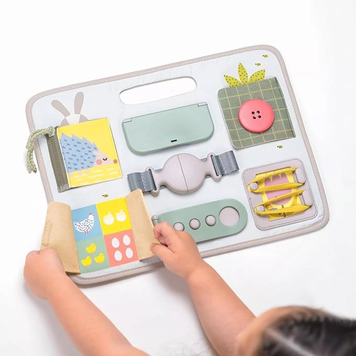 Taf Toys aktivitāšu dēlis ar sprādzēm