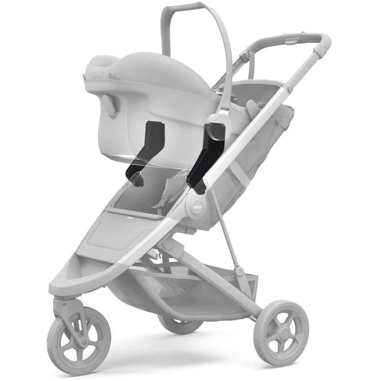 Thule Spring pelēki bērnu ratiņi ar kulbu un sēžamo daļu, redzami četri riteņi un jumtiņš