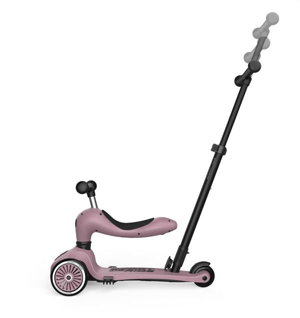 Rozā Scoot and Ride Highwaykick 1 skrejritenis ar stūmējrokturi un melnu kātu